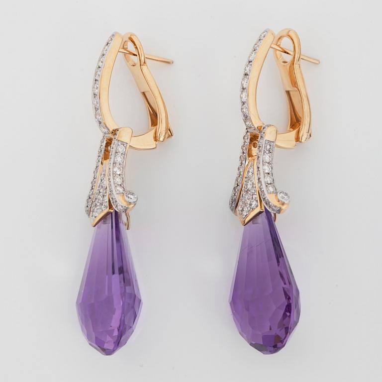 A pair of amethyst, circa 36 cts, and diamond earring.