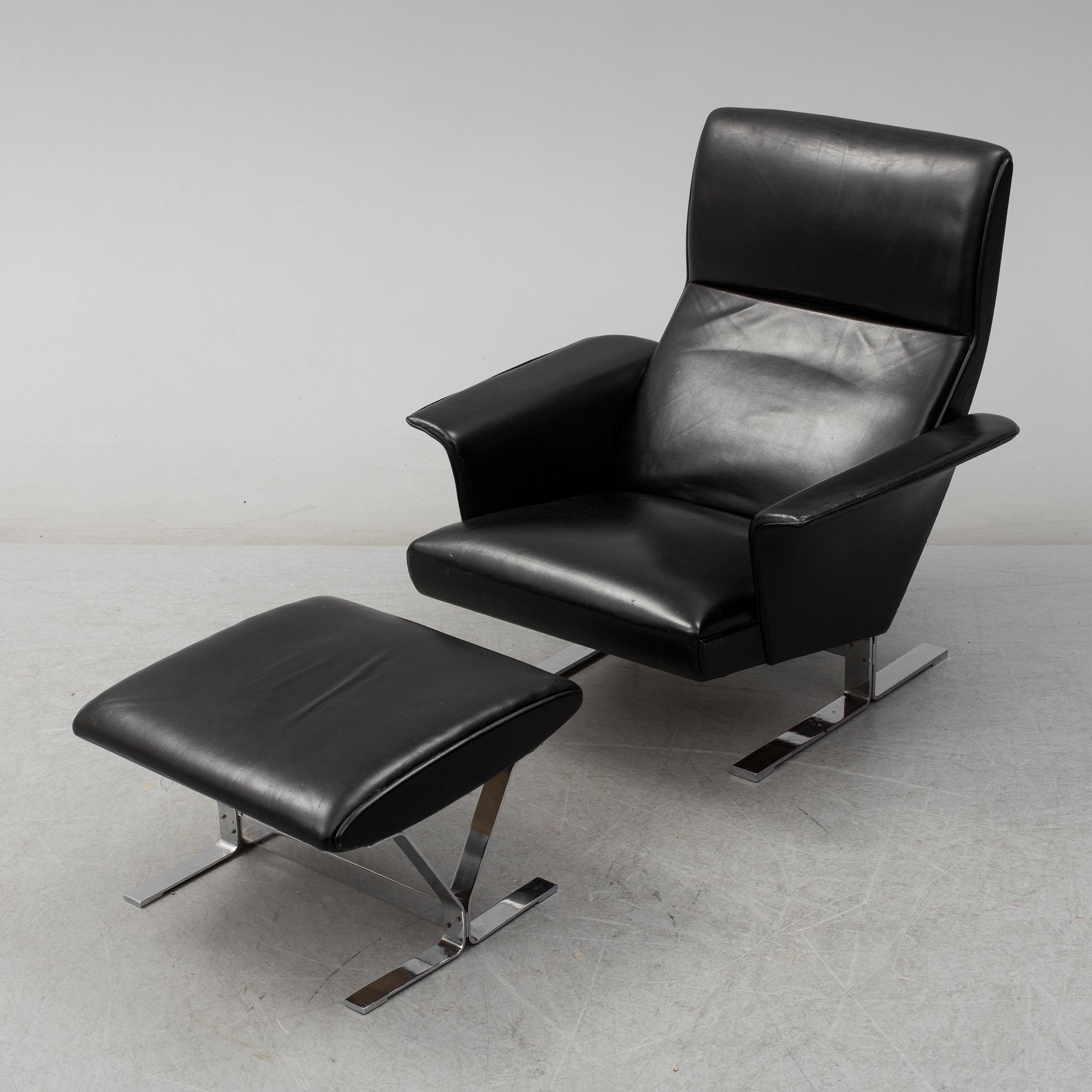 A second half of the 20th century easy chair and stool by Georg Thams, Vejens Polstermöbelfabrik, Denmark.
