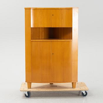 A Swedish Modern corner cabinet, 1940s.