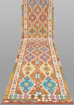 A Kilim runner, classic design, approximately 771 x 127 cm.