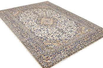 A Kashan rug, a. 250 x 242 cm.