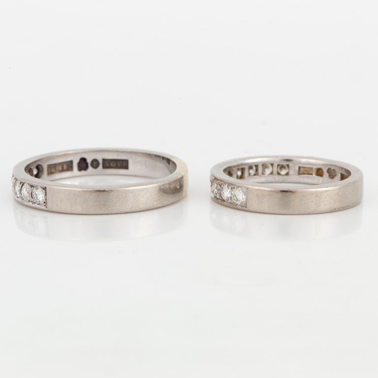 Two half-eternity diamond rings.