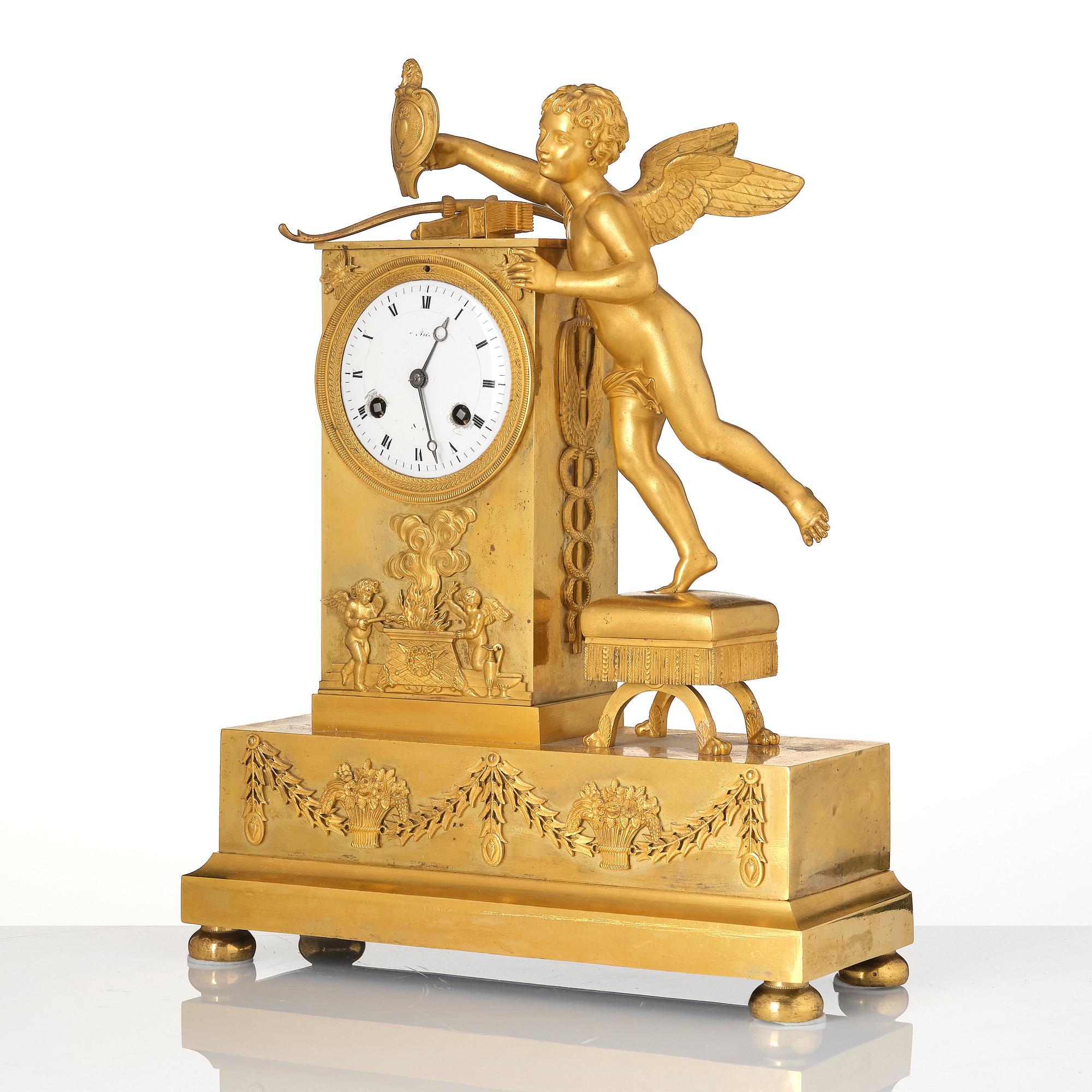 An Empire ormolu figural mantel clock, early 19th century.
