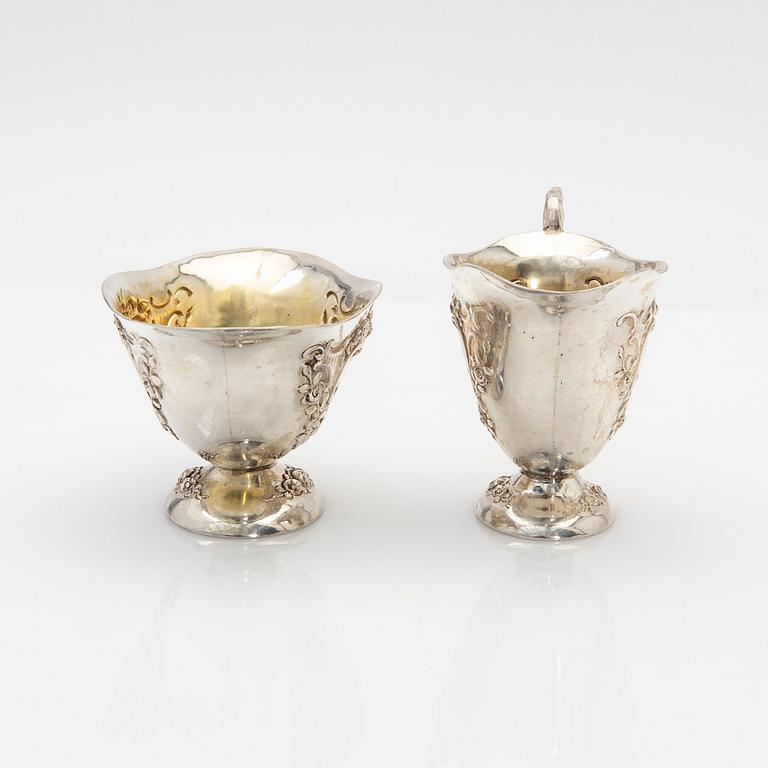 Cream jug and sugar bowl, silver, early 20th century.