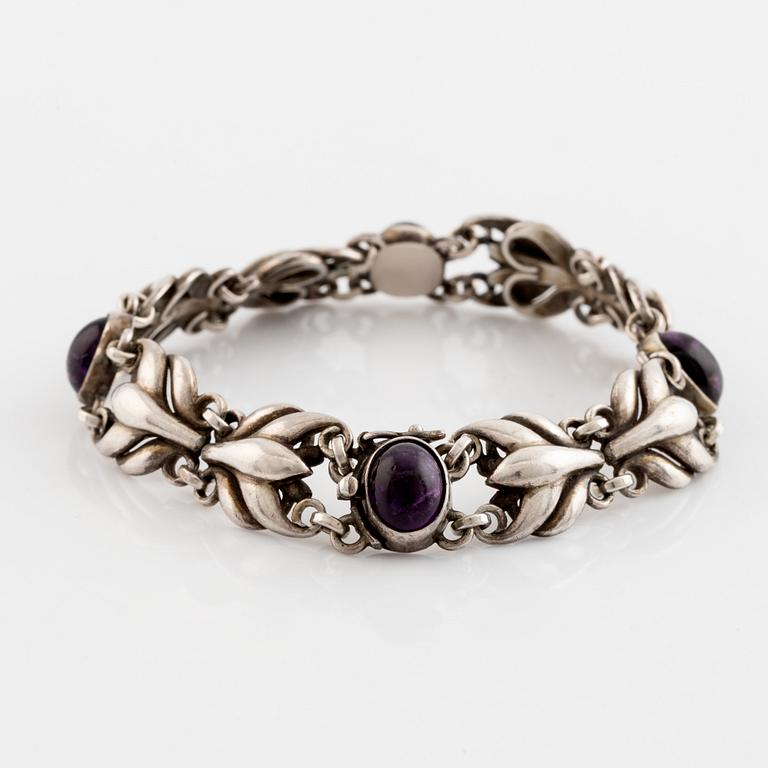 Georg Jensen, a silver bracelet set with cabochon-cut amethysts.