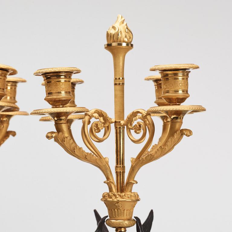 A pair of Empire four light candelabra.