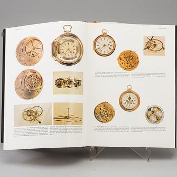 A set of 5 watch books.