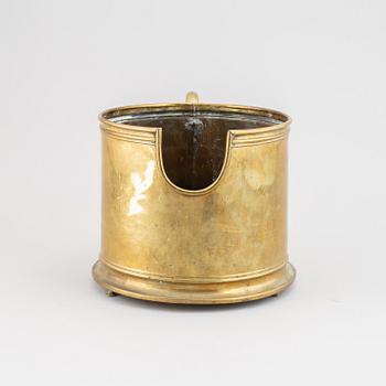 A 19th century brass champagne cooler.