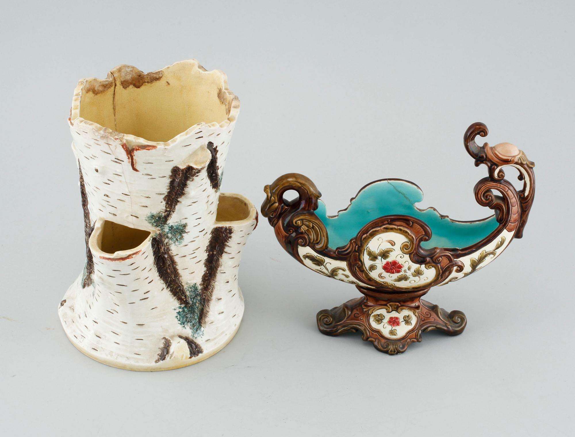 A pair of consoles, a pot and a jardinière in majolica, made by Gustavsberg and Rörstrand around year 1900.