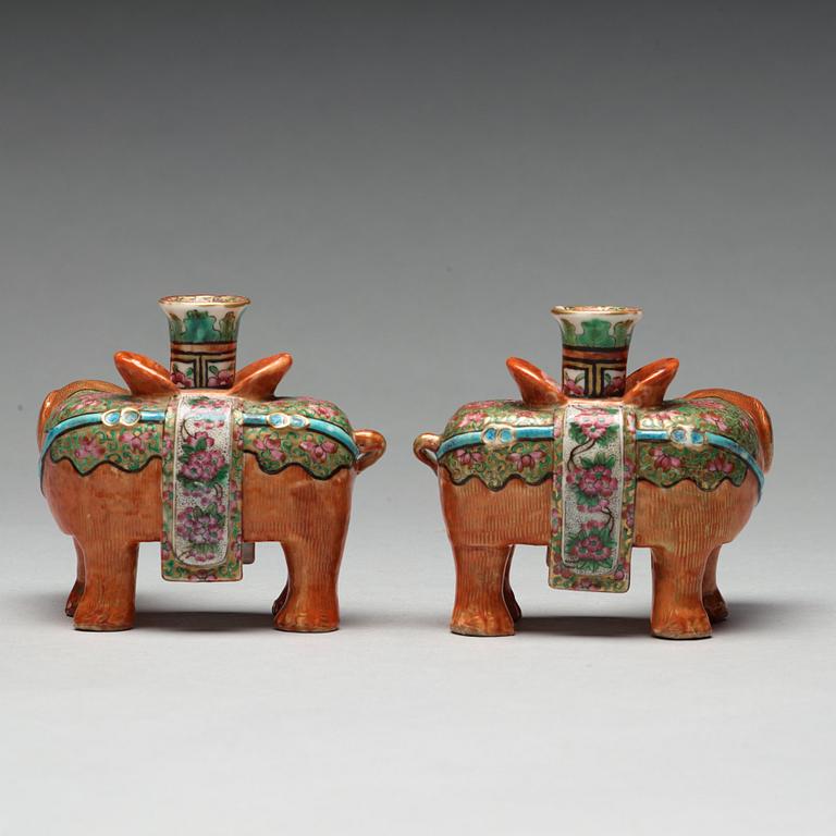 A pair of Canton candle sticks in the shape of elephants, Qing dynasty, 19th century.