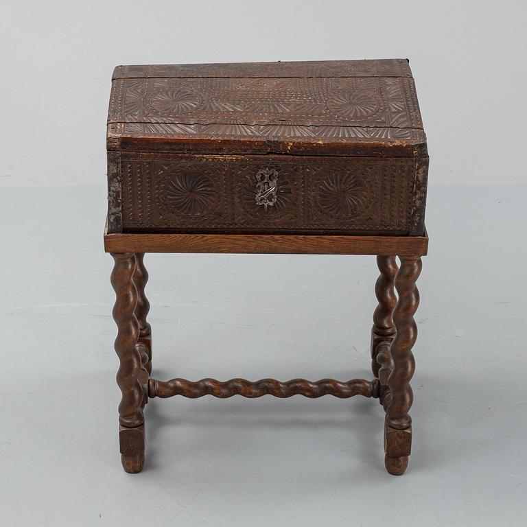 A late 18th or early 19th century wooden box on a stand from early 20th century.