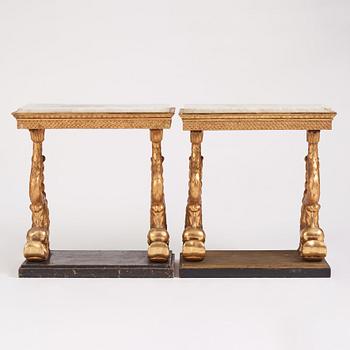 A matched pair of Swedish Empire console tables, first half of the 19th century.