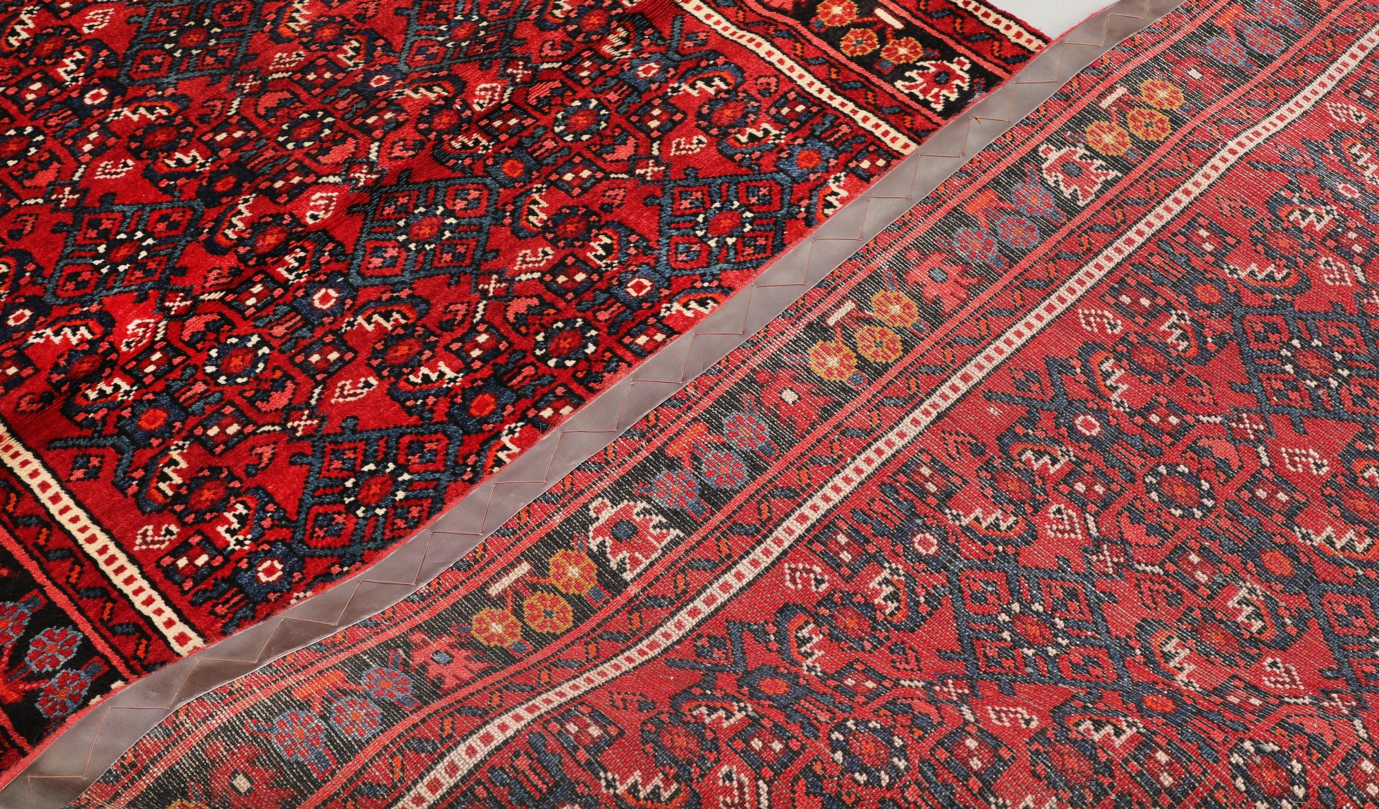 A Hosseinabad runner, c. 418 x 118 cm.