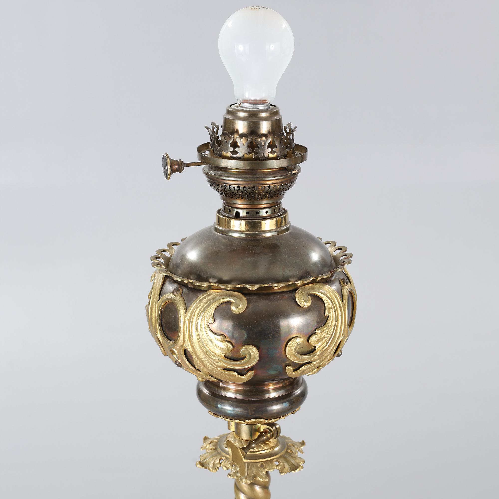 Two floor parafine lamps, 20th century.