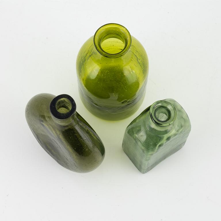 A set of five glass bottles, 18th/19th Century.