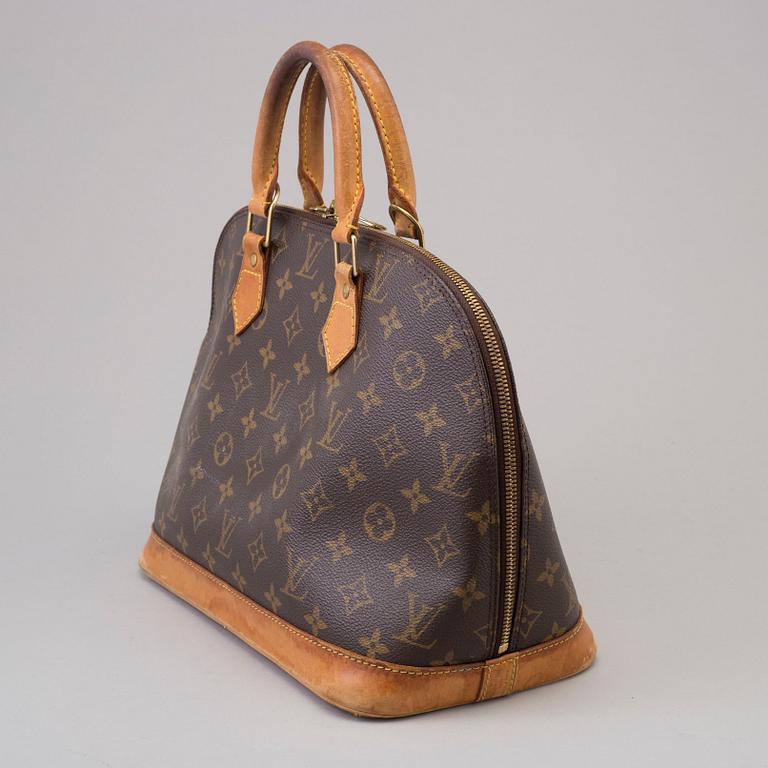 An 'Alma' handbag by Louis Vuitton dated 1997.