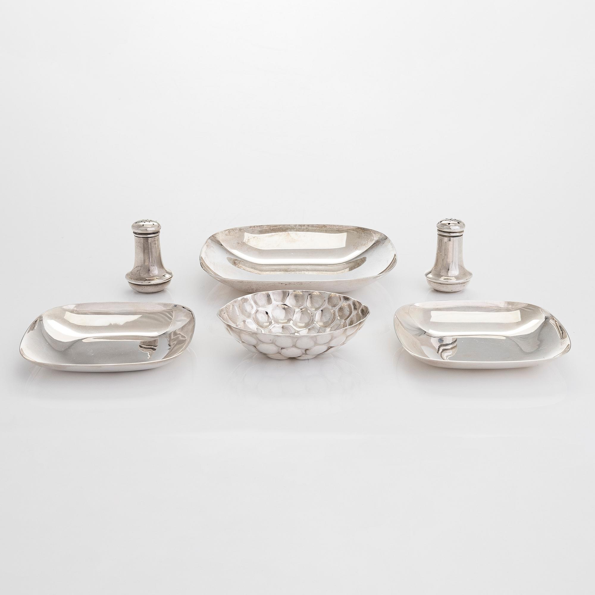Tiffany & Co MAKERS, a four piece set of sterling silver bowls, salt and pepper shakers by other maker.