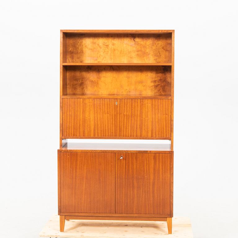 A 1940s mahogany book shelf with writing desk.
