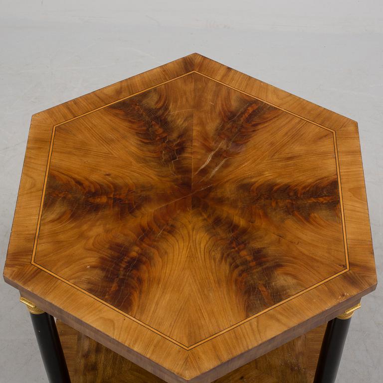 An empire style table, early 20th century.