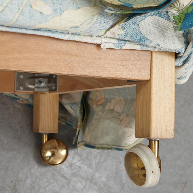 A Swedish armchair and stool, Norell Möbel, late 20th century.