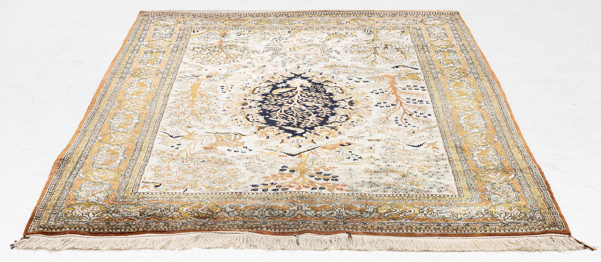 A Ghom, figural, silk rug, c. 205 x 140 cm.