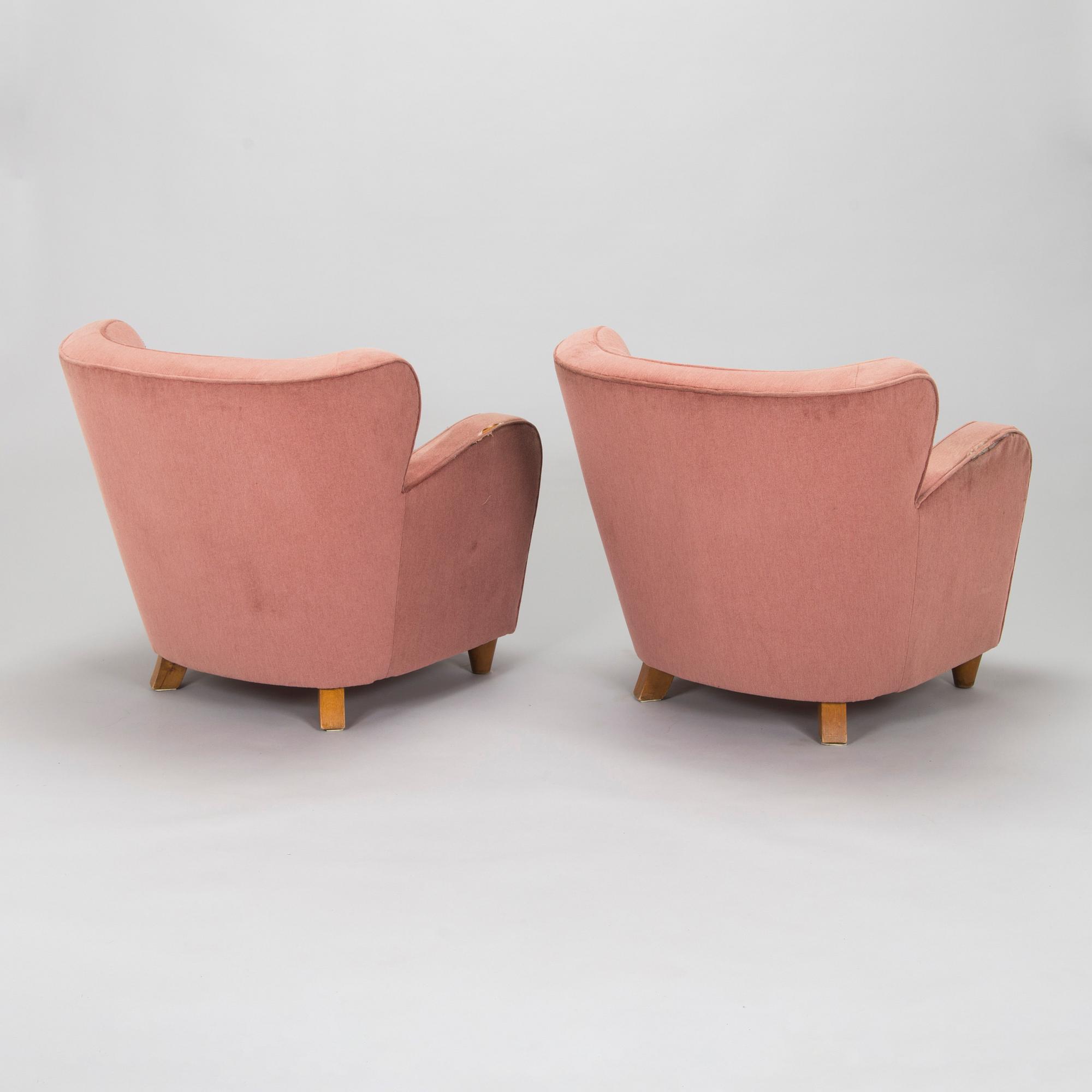 A pair of mid-20th century armchairs.