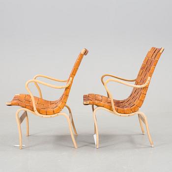 A pair of Bruno Mathsson "Eva" armchairs.