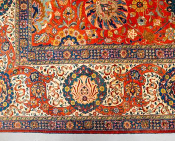 A carpet, a semi-antique Tabriz, ca 528-535 x 346,5-352,5 cm, signed Farhan.