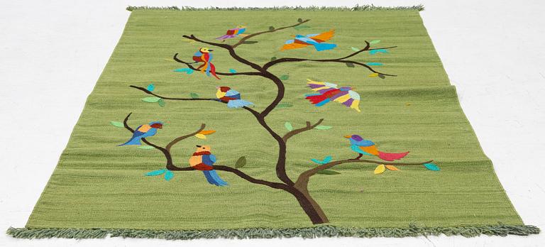 A hand-embroidered Kelim rug, 184 x 124 cm.