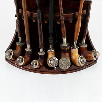 Pipe stand and nine pipes, 19th/20th century.