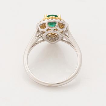 Pear shaped emerald and brilliant cut diamond ring.