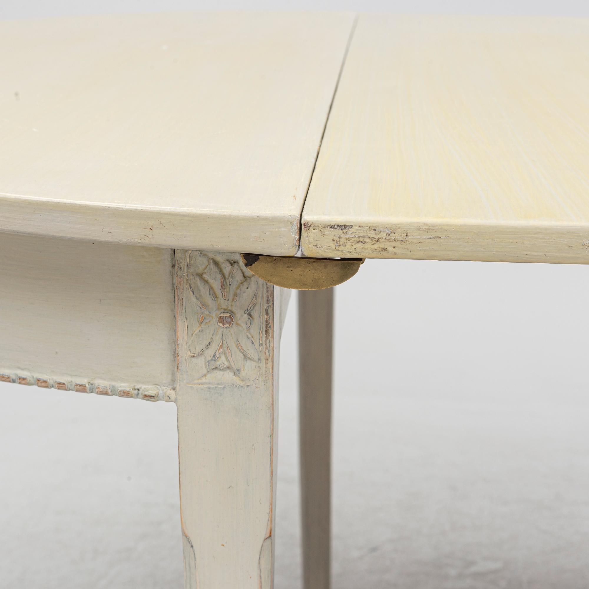 A Gustaivan style dining table/ two crescent shaped tables, end of the 19th century.