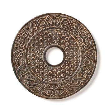 1006. An archaistic bi disc.