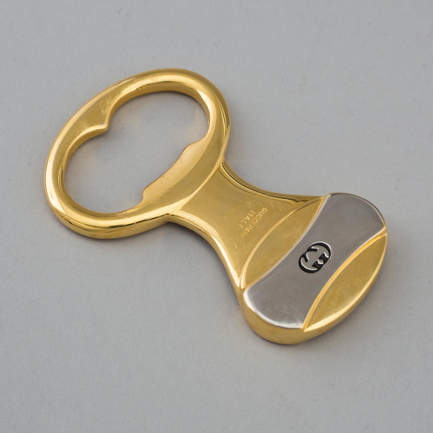GUCCI, flasköppnare.
