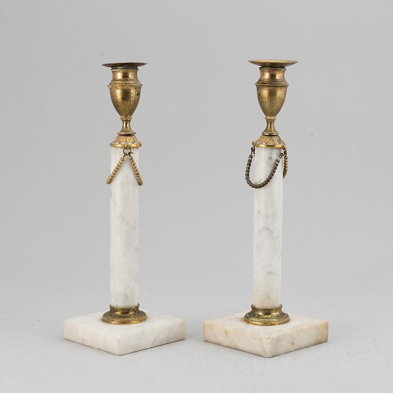 A pair of late Gustavian candle sticks.