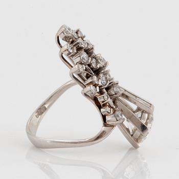 A platinum ring set with an old-cut diamond ca 2.25 cts quality ca I/J si2.