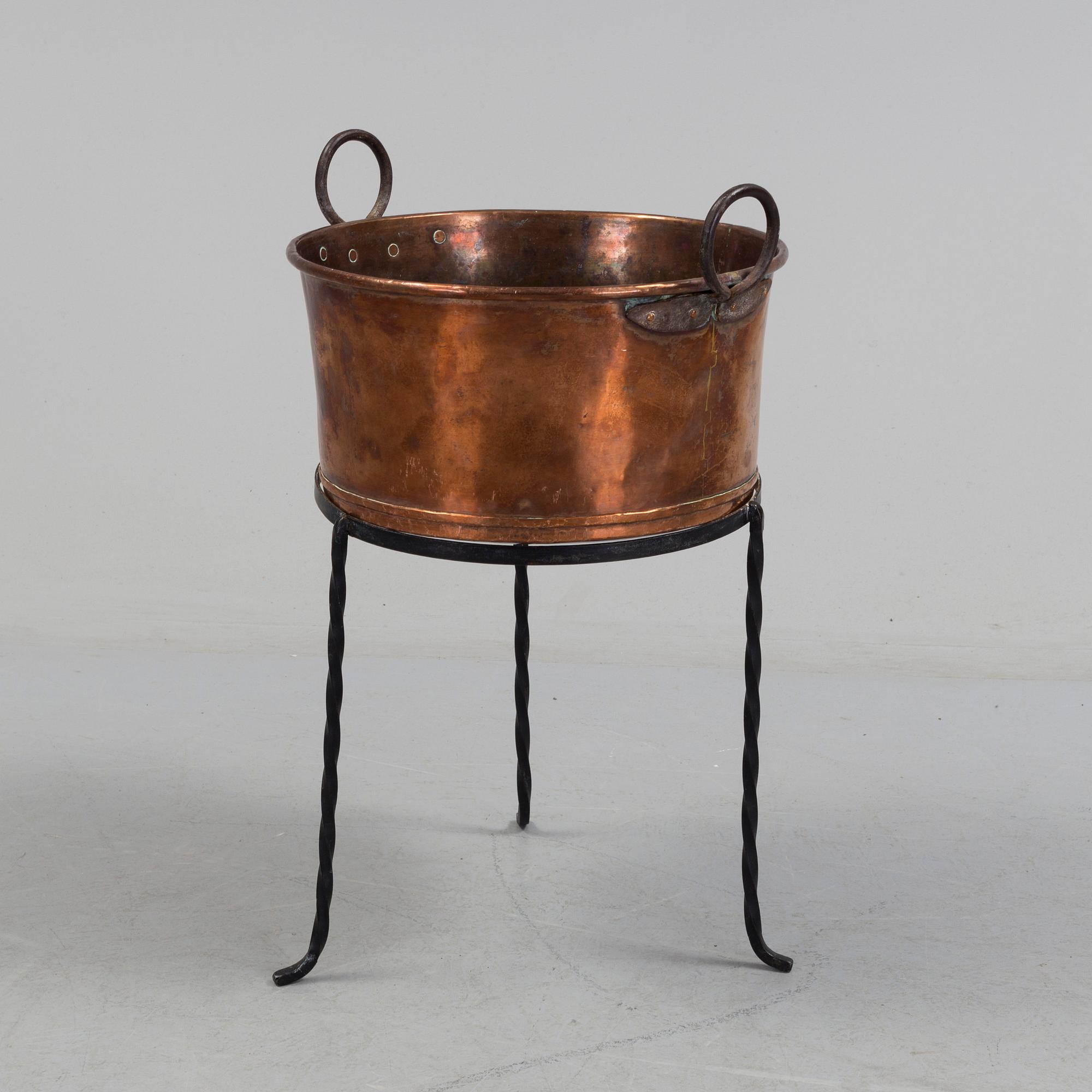 A 19th century copper cauldron.