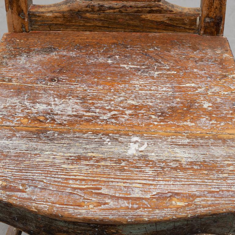 a 18th century wooden chair.