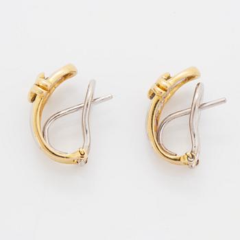 A pair of 18K gold earrings.