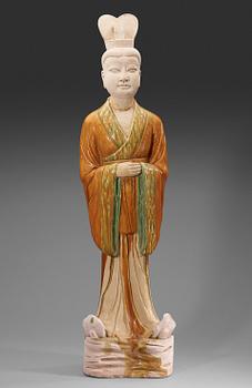 A potted, partially glazed tomb figure of a guardien, Tang dynasty (618-907).