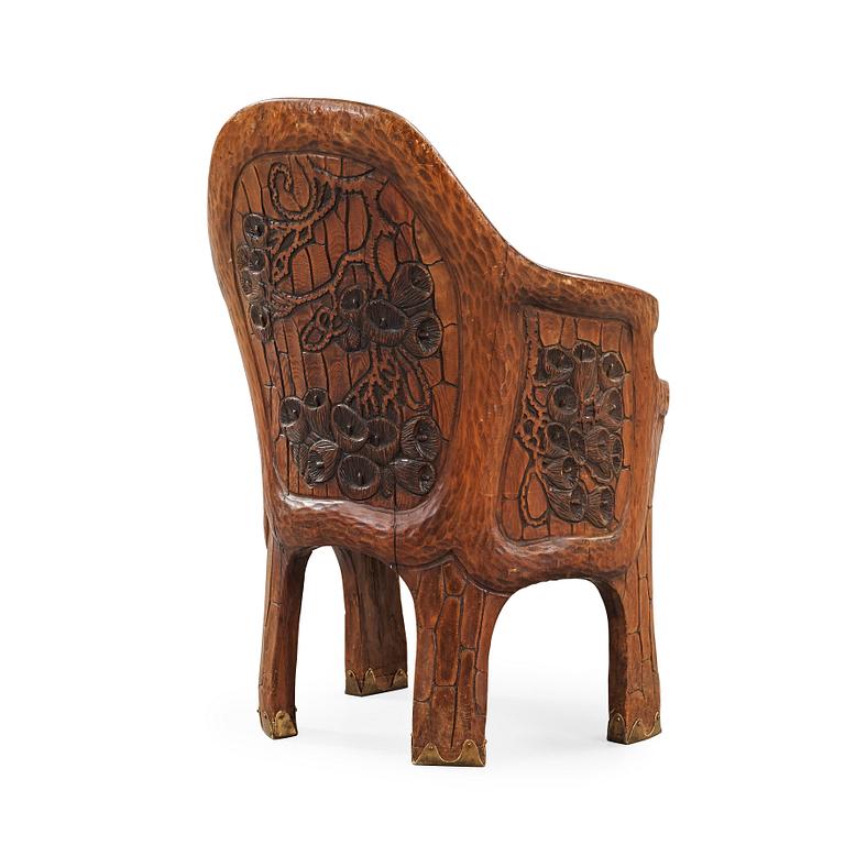 A Gustaf Fjaestad Art Nouveau carved pine chair 'Stabbestol', executed by Adolf Swanson, Arvika, Sweden 1908.