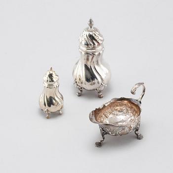 A silver sugar shaker, salt shaker and creamer, 19th-20th century.