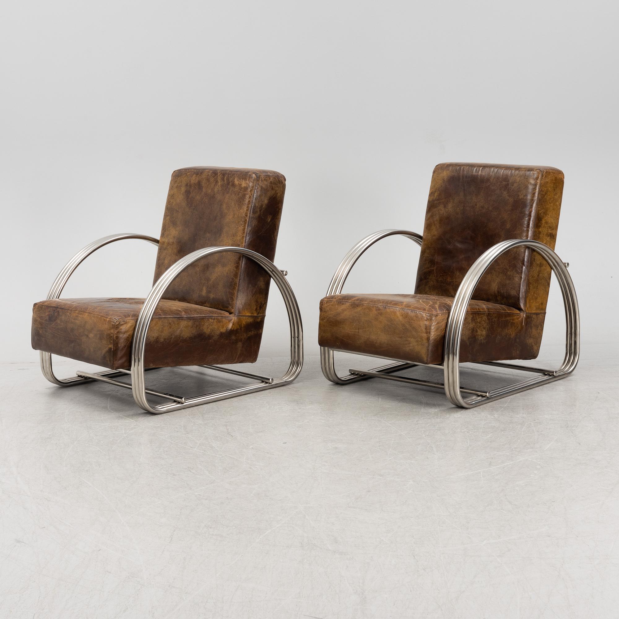 A pair of 'Hudson Street' lounge chairs from Ralph Lauren home.
