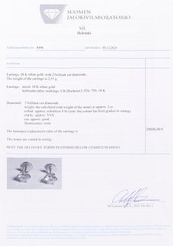 Bucherer, a pair of 18K white gold earrings with brilliant-cut diamond. SJL-certificate.