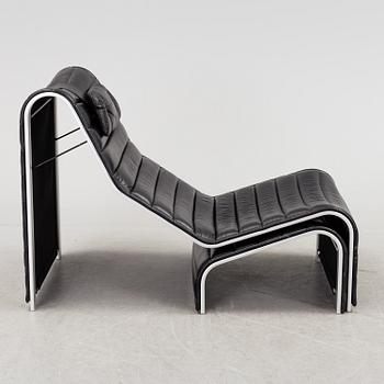 ERIC SIGFRID PERSSON, a leather upholstered lounge chair and foot stool from Möbelkultur AB.