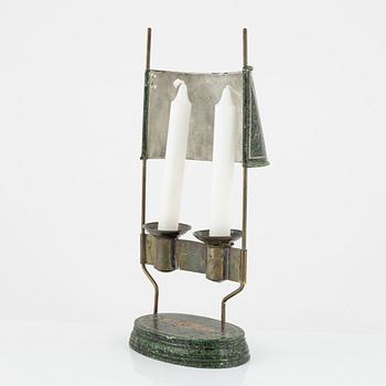 An empire style candlestick, circa 1900.