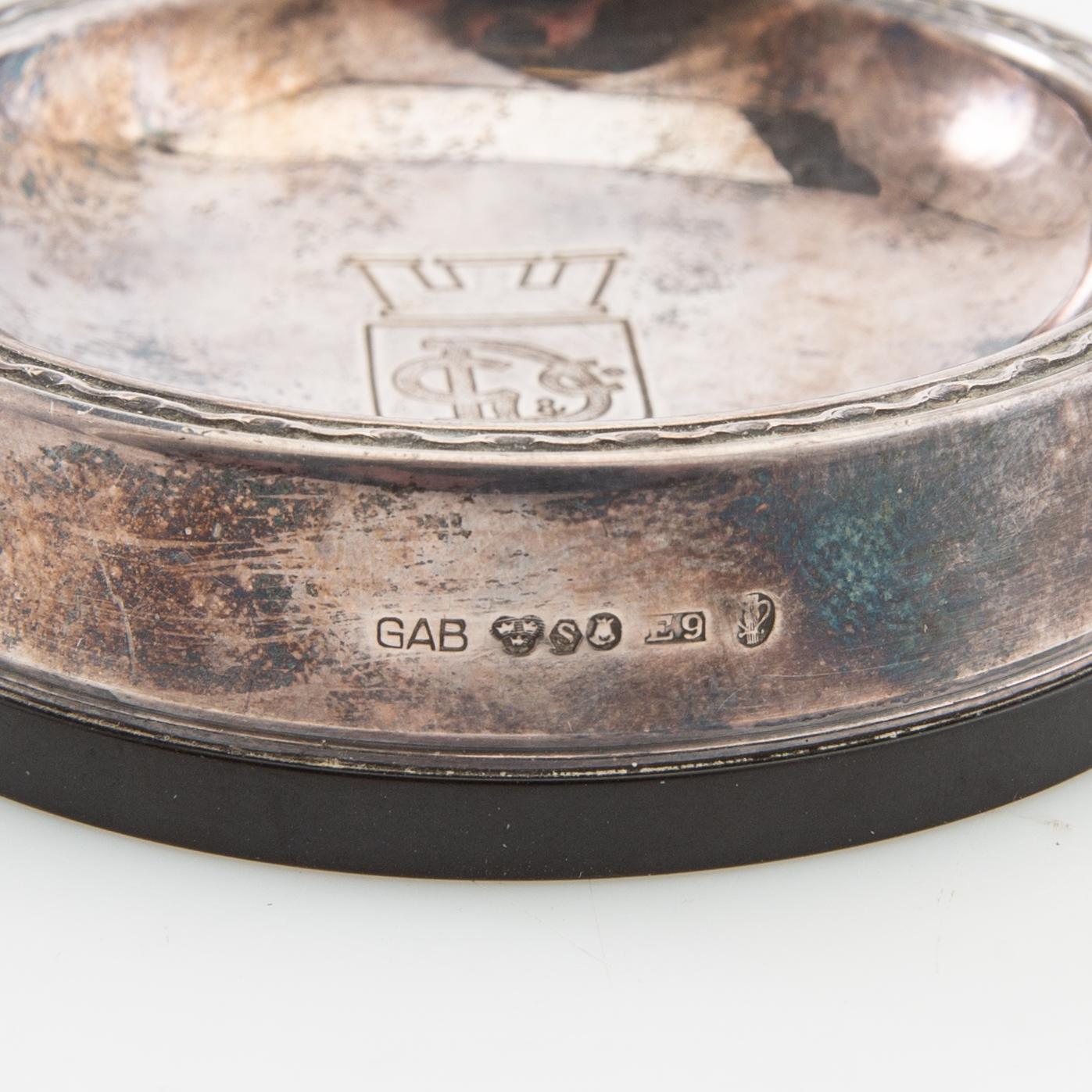 Salt cellars 1 pair and bottle coasters 3 pcs GAB Stockholm 1937, 1938 and 1955 silver and bakelite.