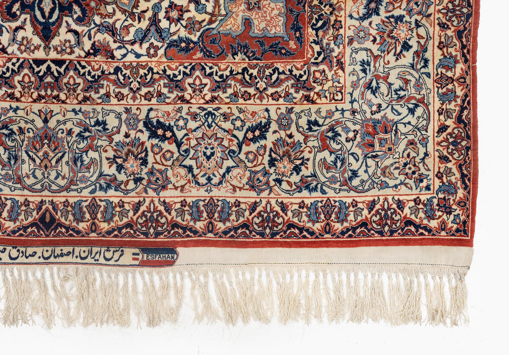 A semi-antique Isfahan rug, signed (Sadegh) Seirafian, c. 244 x 149 cm.