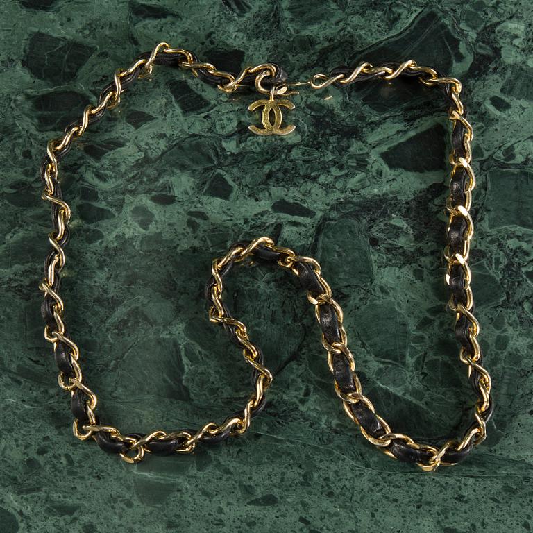 Belt with mini flap-bag by Chanel.