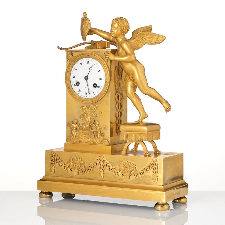 An Empire ormolu figural mantel clock, early 19th century.